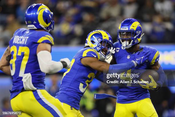 Inglewood, CA Jordan Fuller of the Los Angeles Rams celebrates with his teammates after intercepting a pass thrown by Derek Carr of the New Orleans...