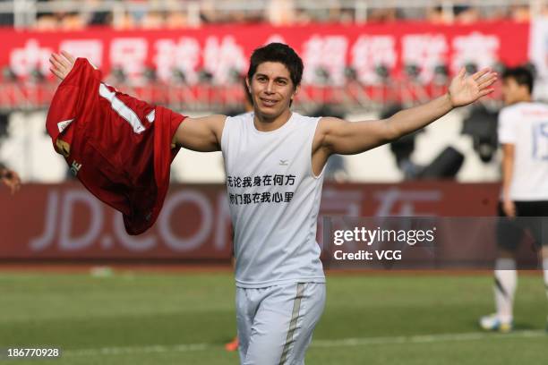 Dario Conca of Guangzhou Evergrande celebrates after scoring his team's second goal during the Chinese Super League match between Guangzhou...