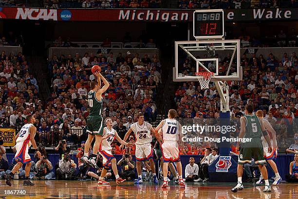 Paul Davis of the Michigan State Spartans takes a shot over the University of Florida Gators in the second round of the South Region of the 2003 NCAA...