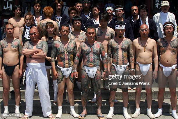 Yakuza gangsters proudly display their tattoos during the the Sanja Matsuri Festival in Tokyo Asakusa.