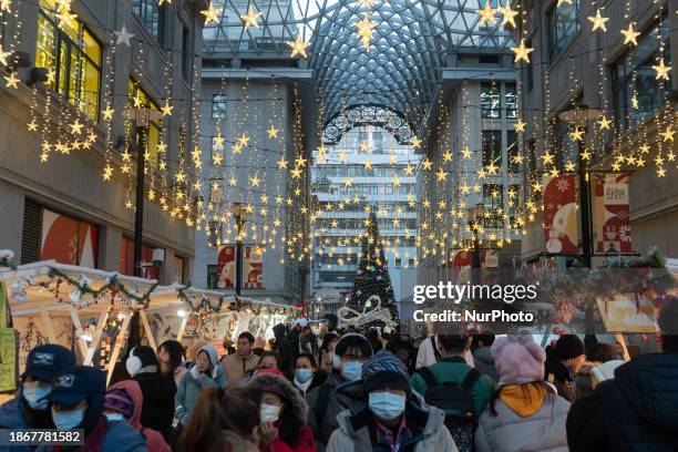 Visitors are participating in a Christmas market in Shanghai, China, on December 22, 2023.