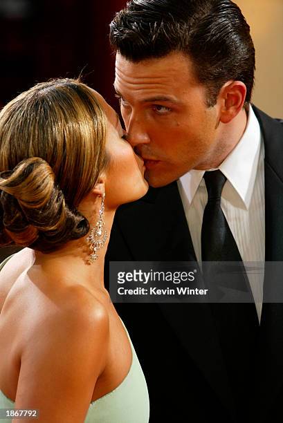 Actor Ben Affleck kisses fiancee, actress Jennifer Lopez, wearing Harry Winston jewelry, at the 75th Annual Academy Awards at the Kodak Theater on...