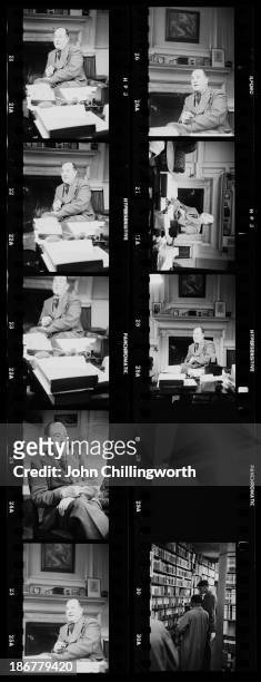 Contact sheet showing English novelist and scholar C. S. Lewis , a fellow and tutor of Magdalen College, Oxford, in his college rooms, November 1950....