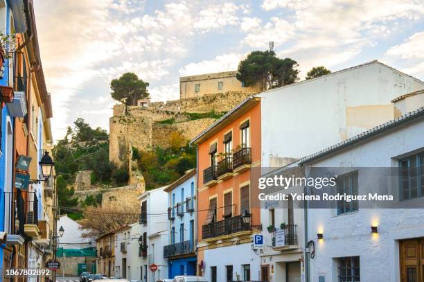 old houses fortified wall - denia stock pictures, royalty-free photos & images