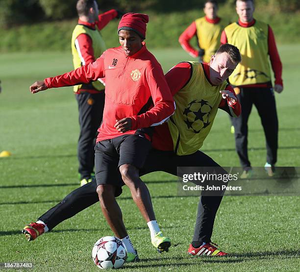 Ashley Young and Phil Jones of Manchester United in action during a first team training session, ahead of their UEFA Champions League Group A match...