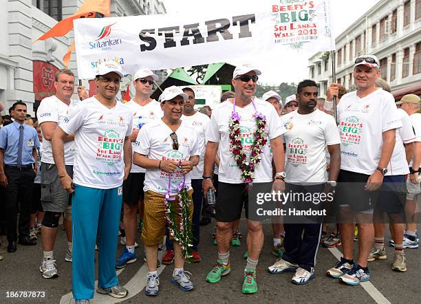 In this handout image provided by Laureus, Sir Ian Botham poses with Sourav Ganguly and Sunil Gavaskar at the start line on the fourth day of Beefy's...