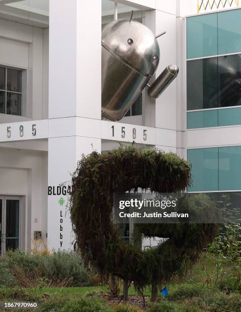 An Android character is displayed at Google headquarters on December 19, 2023 in Mountain View, California. Google has agreed to pay $700 million as...
