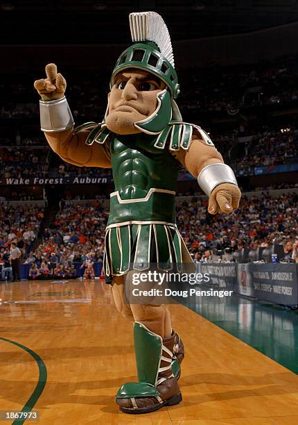 The mascot for the Michigan State Spartans cheers for his team against the University of Florida Gators in the second round of the South Region of...