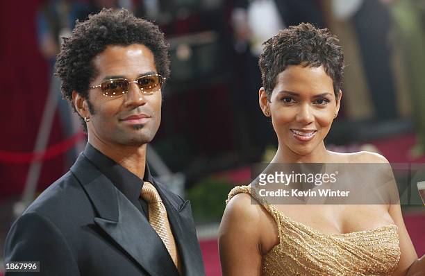 Actress Halle Berry, wearing Harry Winston jewelry, and husband Eric Benet attends the 75th Annual Academy Awards at the Kodak Theater on March 23,...