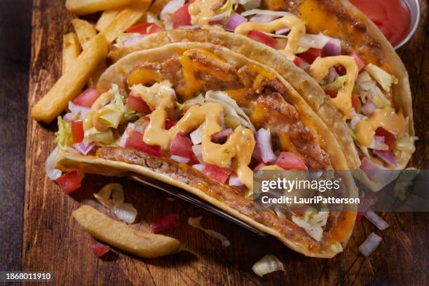 the viral smash ground chicken cheese burger taco - turkey burger stock pictures, royalty-free photos & images