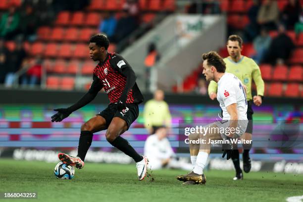 Bryang Kayo of FC Ingolstadt 04 challenged by Mirnes Pepic of FC Erzgebirge Aue during the 3. Liga match between FC Ingolstadt 04 and Erzgebirge Aue...