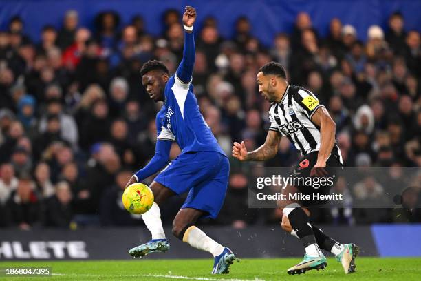 Benoit Badiashile of Chelsea is challenged by Callum Wilson of Newcastle United during the Carabao Cup Quarter Final match between Chelsea and...