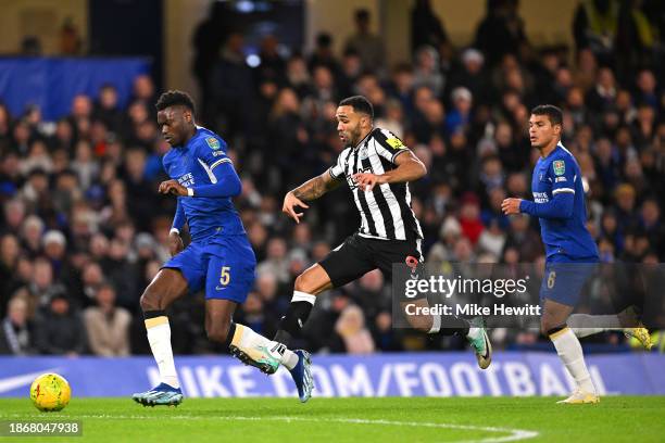 Benoit Badiashile of Chelsea is challenged by Callum Wilson of Newcastle United during the Carabao Cup Quarter Final match between Chelsea and...