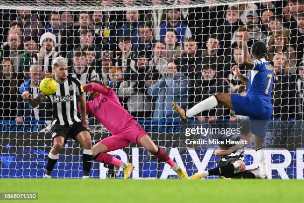 Raheem Sterling of Chelsea has a shot blocked by Bruno Guimaraes of Newcastle United during the Carabao Cup Quarter Final match between Chelsea and...