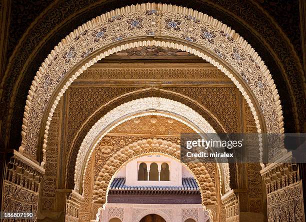 ornate decoration at albambra palace in granada, spain - granada spain landmark stock pictures, royalty-free photos & images