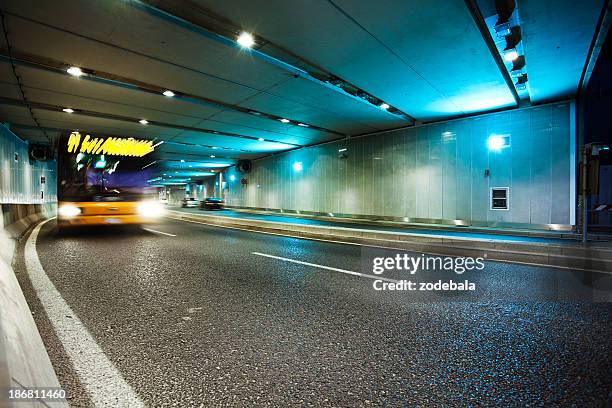 tunnel and traffic in milan - underpass stock pictures, royalty-free photos & images