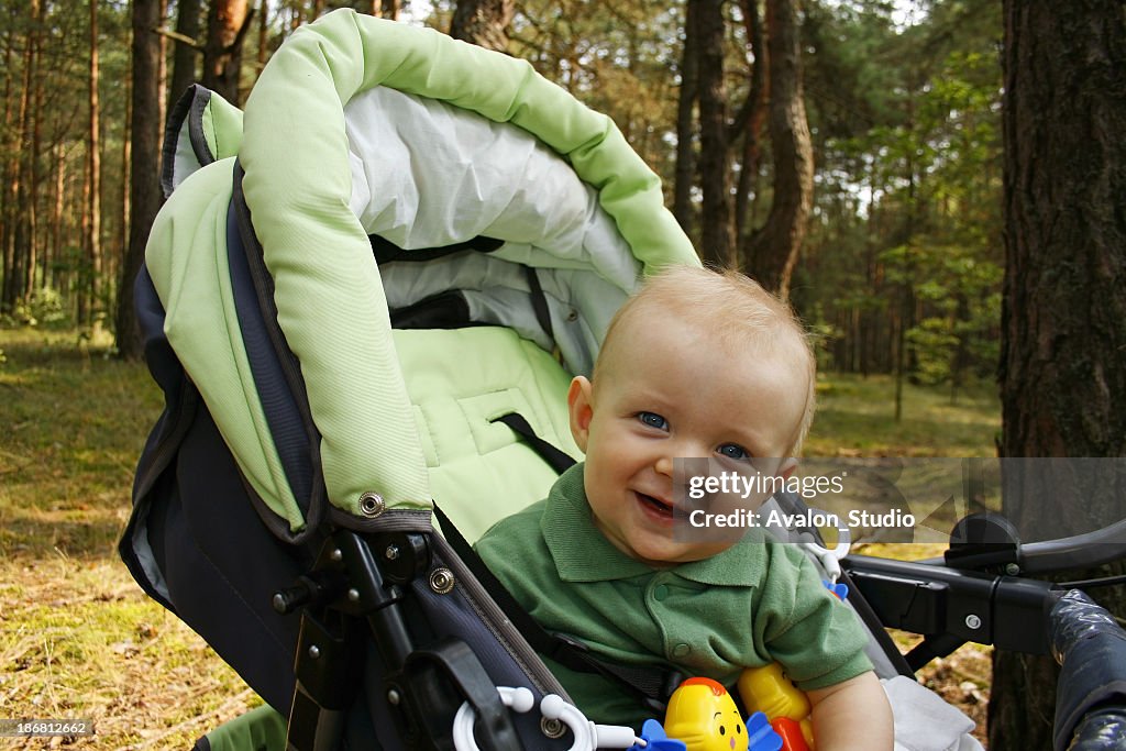 Happy baby in forest