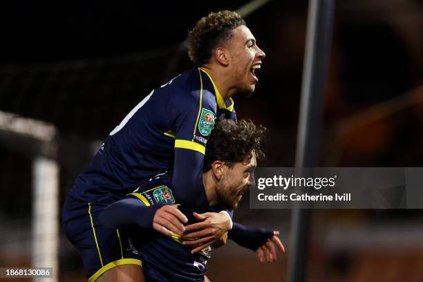 Matt Crooks of Middlesbrough celebrates with team mate Morgan Rogers after scoring their sides third goal during the Carabao Cup Quarter Final match...