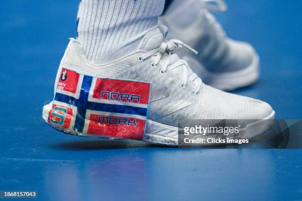 Nora Mork of Norway has a national flag sticker on her shoe during the IHF Women's World Championship handball final match between France and Norway...