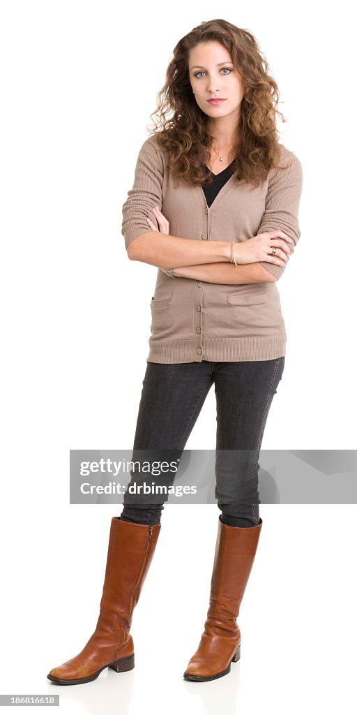 Young woman standing and looking at camera with arms crossed