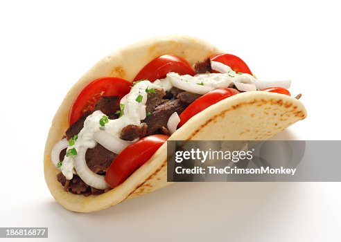 Close-up of a Gyros or Doner Kebab on white background Close-up of a Gyros or Doner Kebab on white background