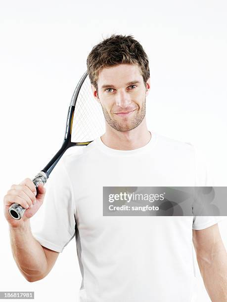 Man Using Tennis Racket Handsome Man Holding A Tennis Racket Smiling High-Res Stock Photo ...