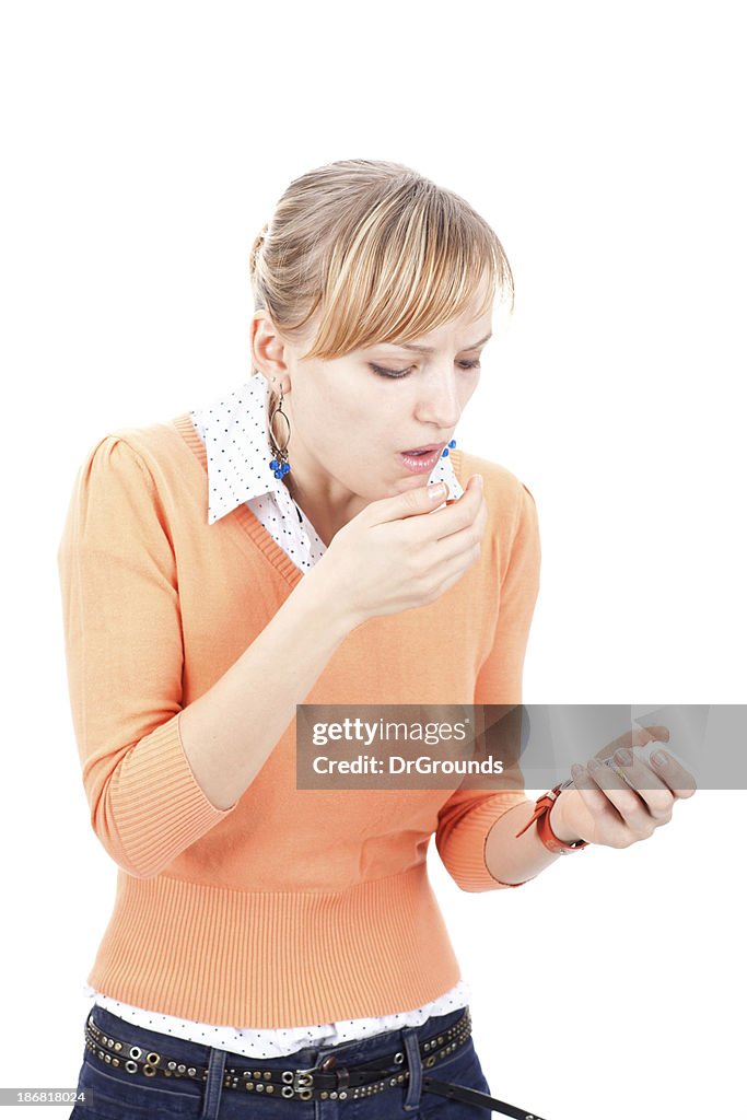 Young woman coughing and holding bottle of medicine