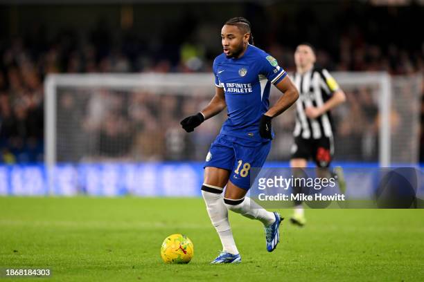 Christopher Nkunku of Chelsea runs with the ball during the Carabao Cup Quarter Final match between Chelsea and Newcastle United at Stamford Bridge...