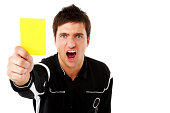 Referee showing the yellow card on white