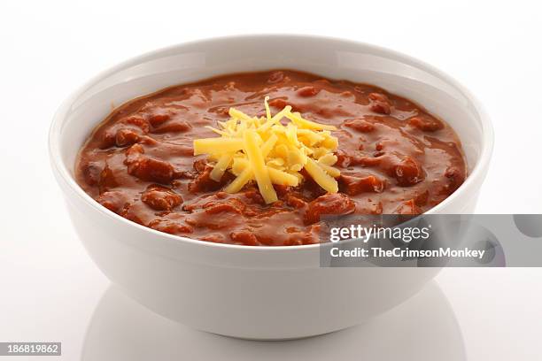 bowl full of chili beans topped with cheddar cheese - ground beef stew stock pictures, royalty-free photos & images