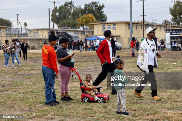 Los Angeles, CA Nickerson Gardens housing project community members gather for Top Dawg Entertainment's 10th annual toy drive and concert featuring...