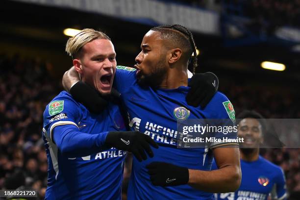 Mykhaylo Mudryk of Chelsea celebrates with team mate Christopher Nkunku after scoring their sides first goal during the Carabao Cup Quarter Final...