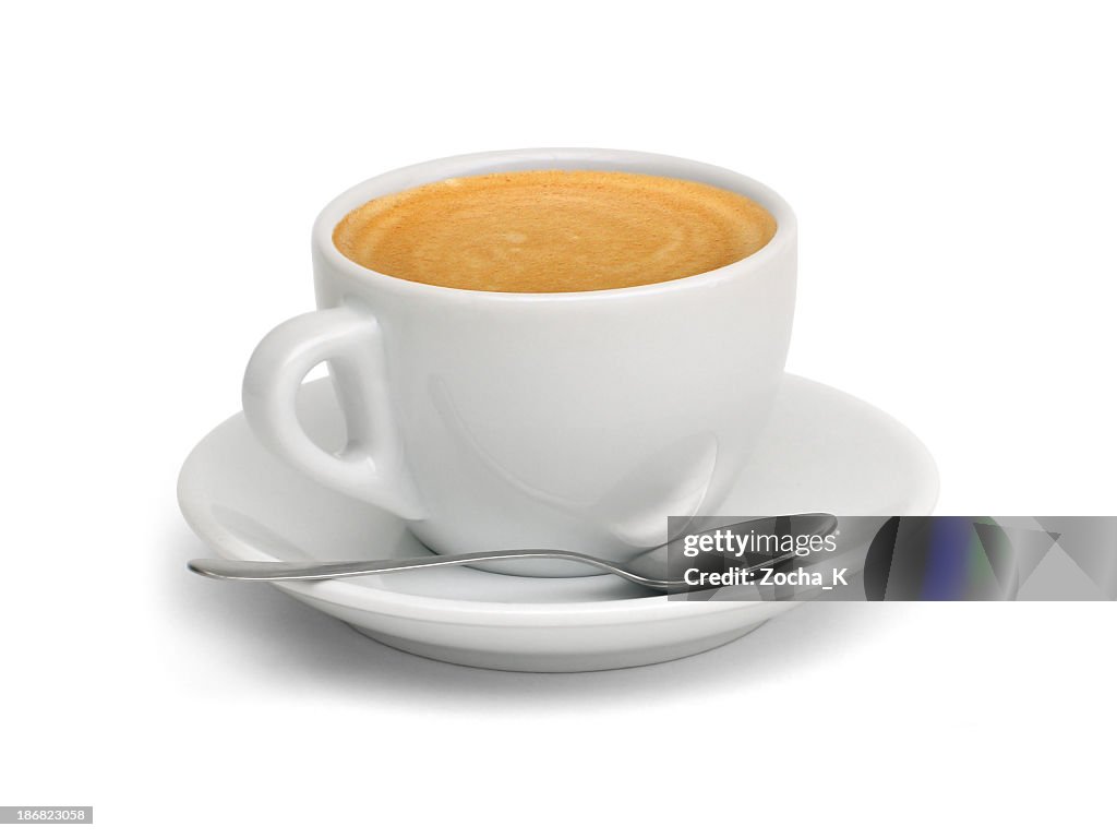A cup of coffee with a spoon and saucer