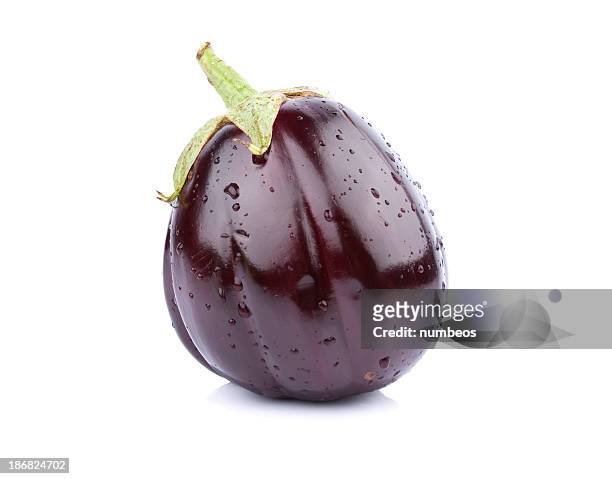 a single purple eggplant on a white background - aubergine stock pictures, royalty-free photos & images