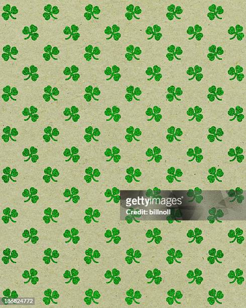 paper with glitter clover pattern - st patricks background stock pictures, royalty-free photos & images