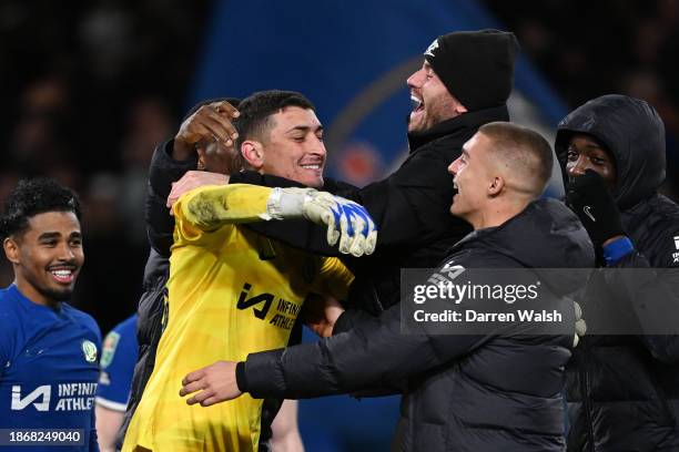 Djordje Petrovic of Chelsea celebrates their sides victory with team mates after saving a penalty taken by Matt Ritchie of Newcastle United following...