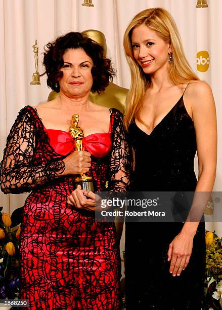 Designer Colleen Atwood poses with her Achievement In Costume Design award for "Chicago" with actress Mira Sorvino backstage during the 75th Annual...