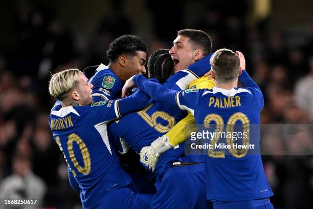 Djordje Petrovic of Chelsea celebrates their sides victory with team mates after saving a penalty taken by Matt Ritchie of Newcastle United following...