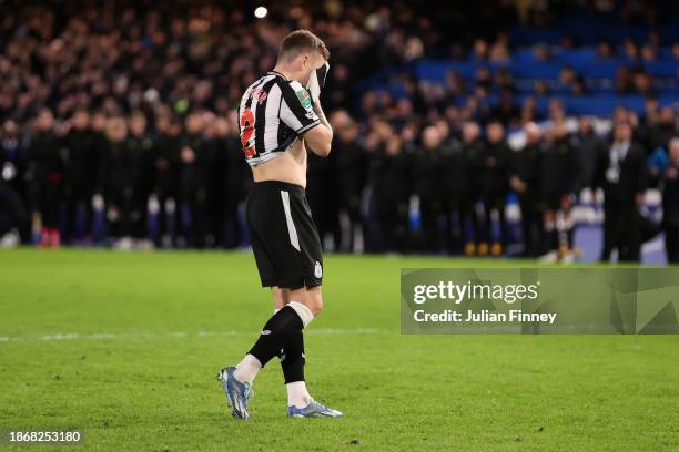 Kieran Trippier of Newcastle United looks dejected after missing their sides second penalty during a penalty shoot out in the Carabao Cup Quarter...
