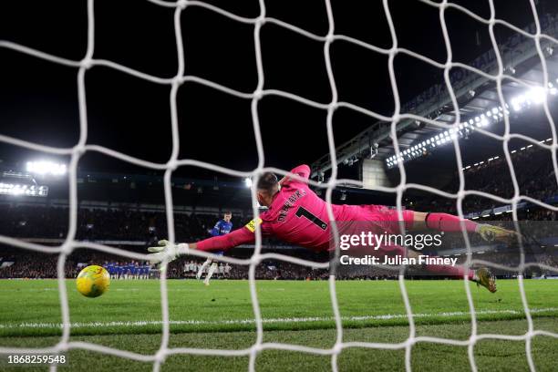 Martin Dubravka of Newcastle United fails to save a penalty taken by Cole Palmer of Chelsea during a penalty shoot out in the Carabao Cup Quarter...