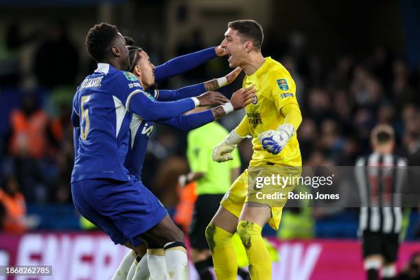 Keeper Djordje Petrovic of Chelsea celebrates with team-mates after he saves Matt Ritchie of Newcastle United penalty to win the shoot-out after a...