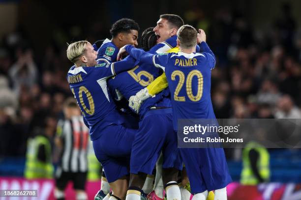 Keeper Djordje Petrovic of Chelsea celebrates with team-mates after he saves Matt Ritchie of Newcastle United penalty to win the shoot-out after a...