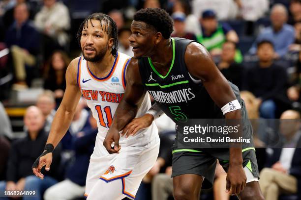 Jalen Brunson of the New York Knicks and Anthony Edwards of the Minnesota Timberwolves interact during free throws in the fourth quarter at Target...