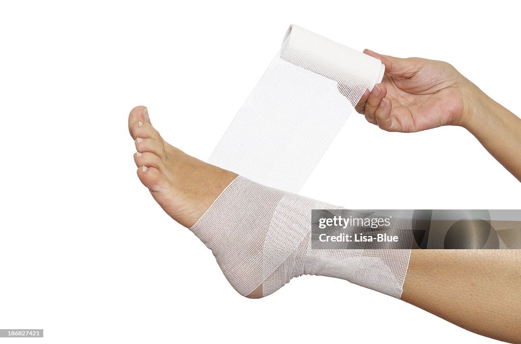 Woman Self Bandaging Ankle