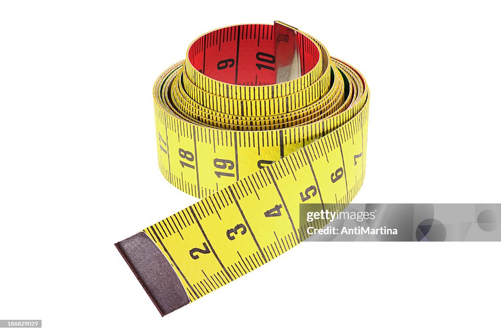 Rolled yellow tape measure isolated on white
