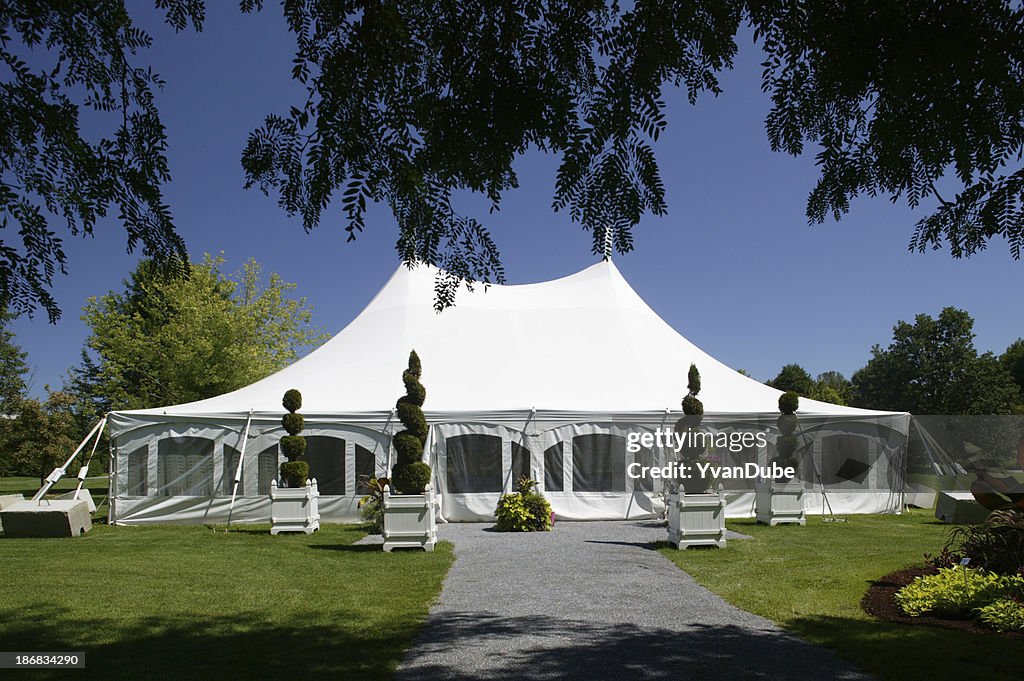 Large white party canopy in the park