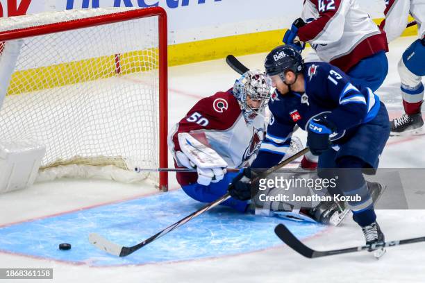 Gabriel Vilardi of the Winnipeg Jets slides the puck past goaltender Ivan Prosvetov of the Colorado Avalanche for a third period goal at Canada Life...