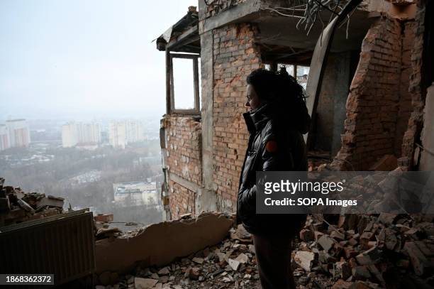 Local resident inspects the damage at a multi-storey residential building damaged by shrapnel from a downed kamikaze drone of the Russian army in...