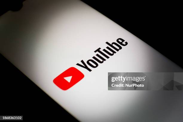The YouTube logo is displayed on a smartphone screen in Athens, Greece, on December 22, 2023.