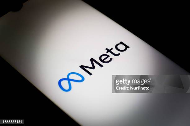 The Meta logo is displayed on a smartphone screen in Athens, Greece, on December 22, 2023.
